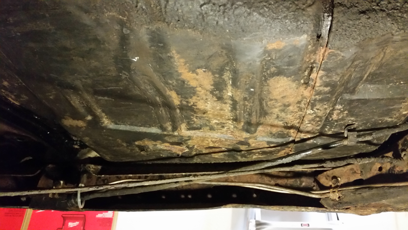 Under the heavy, rubbery undercoating lies some surface rust and original paint. To the left you can see what it will look like when I’m done - clean, gloss black.